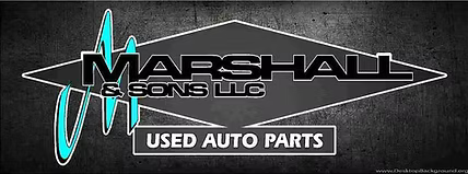 Marshall and Sons with banner.jpg